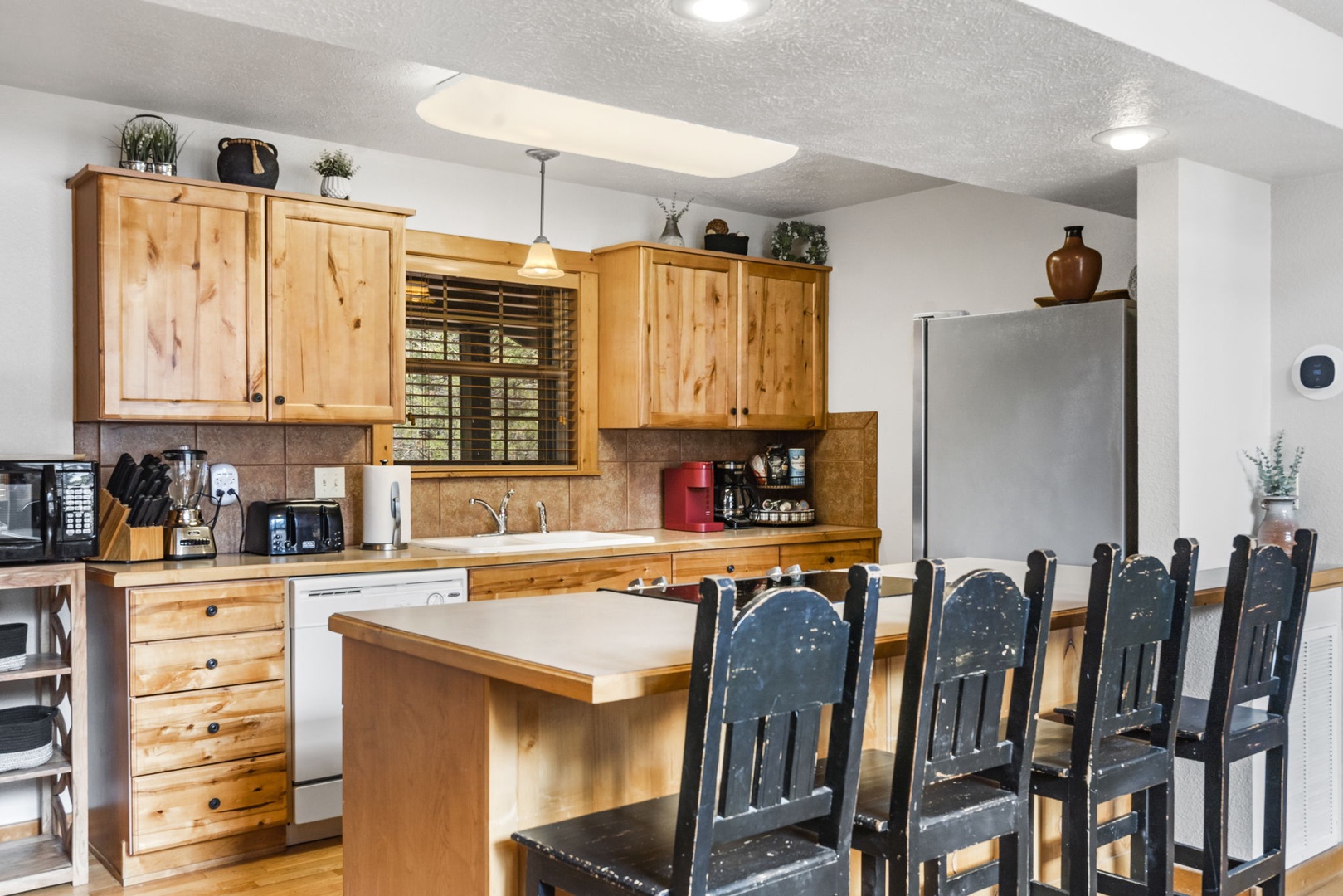 Your open kitchen offering wonderful conveniences and counter seating for 4