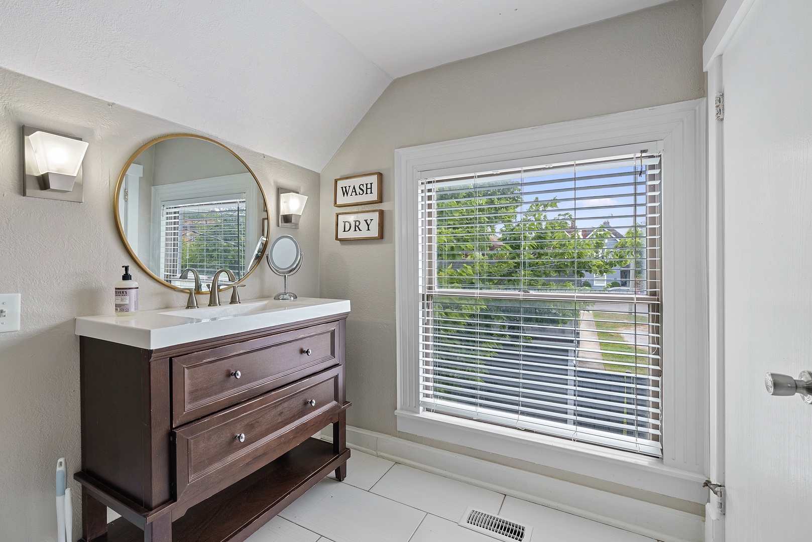 Wash up in the 2nd-floor full bath, with a single vanity & shower/tub combo