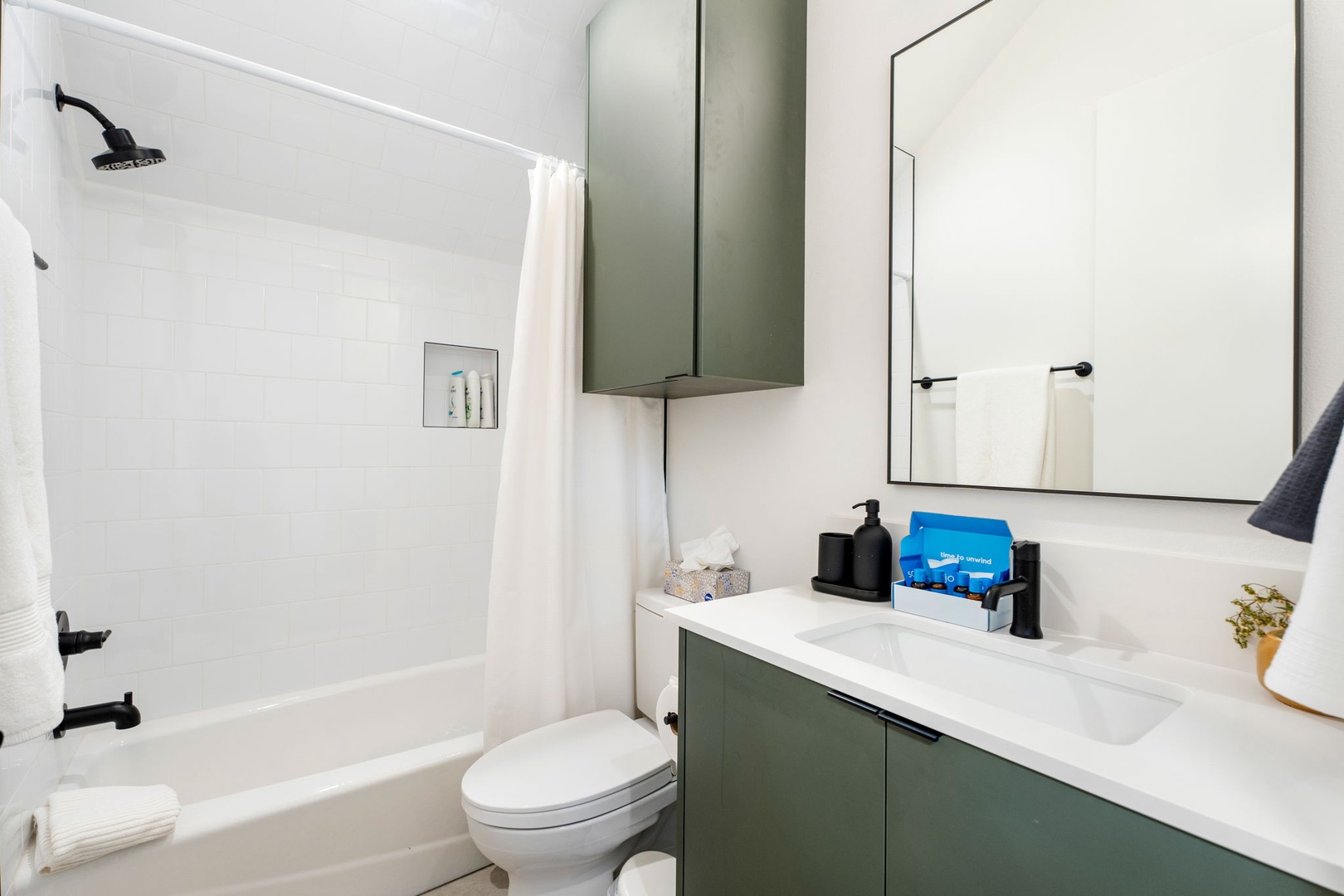 The 1st floor full bathroom offers a single vanity & shower/tub combo