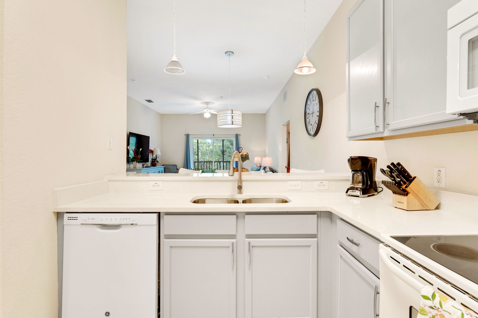 The open, airy kitchen offers ample space & all the comforts of home