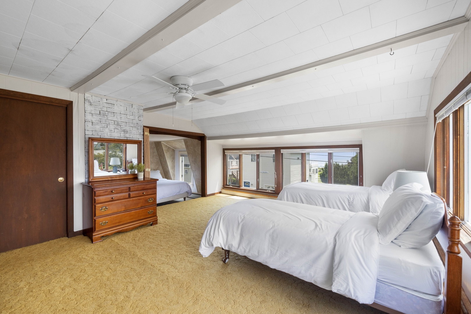 The 2nd bedroom, with a full-sized bed, a pair of twin beds, & twin-over-twin bunks