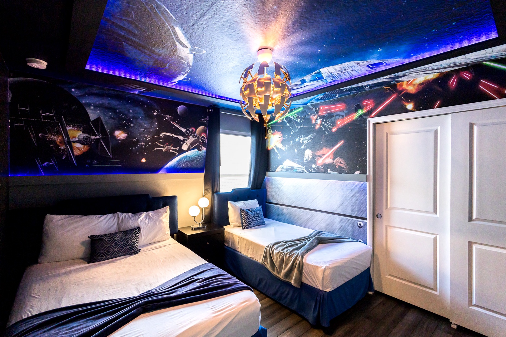 Be One With the Force in this Star Wars themed room with a Full bed, and Twin bed
