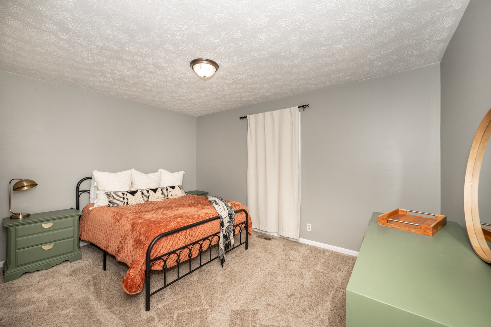 This upper-level bedroom includes a queen bed & ample storage
