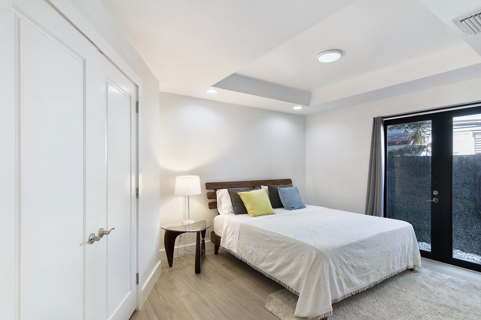 This polished 1st-floor queen suite includes a private ensuite & patio access