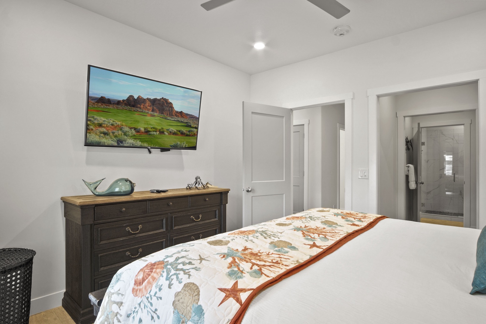 The tranquil Master Suite offers a Smart TV, En Suite, and Patio Access