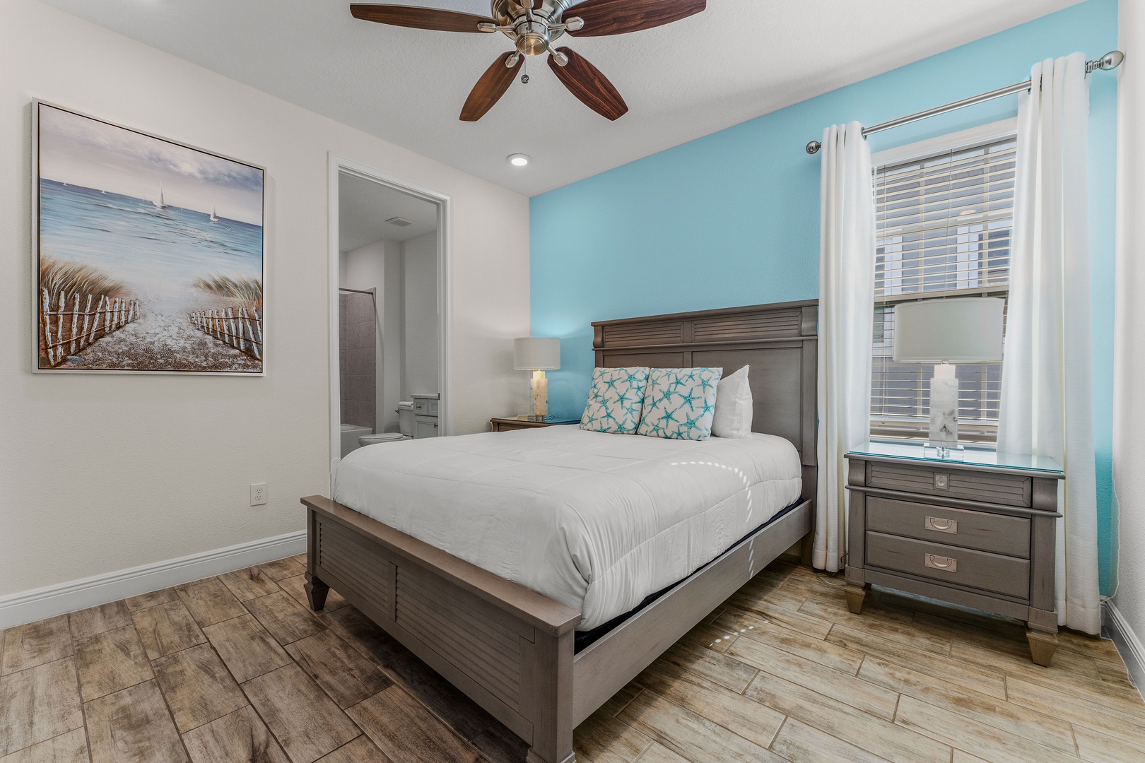 This beachy 2nd-floor queen suite features a private ensuite & Smart TV