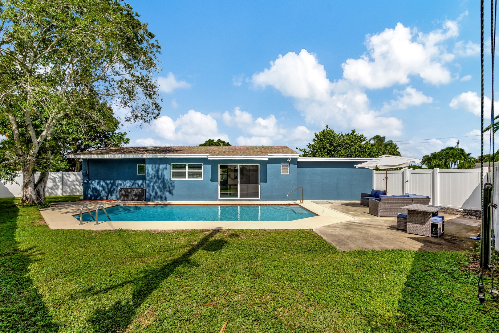 Back yard with private pool and outdoor seating