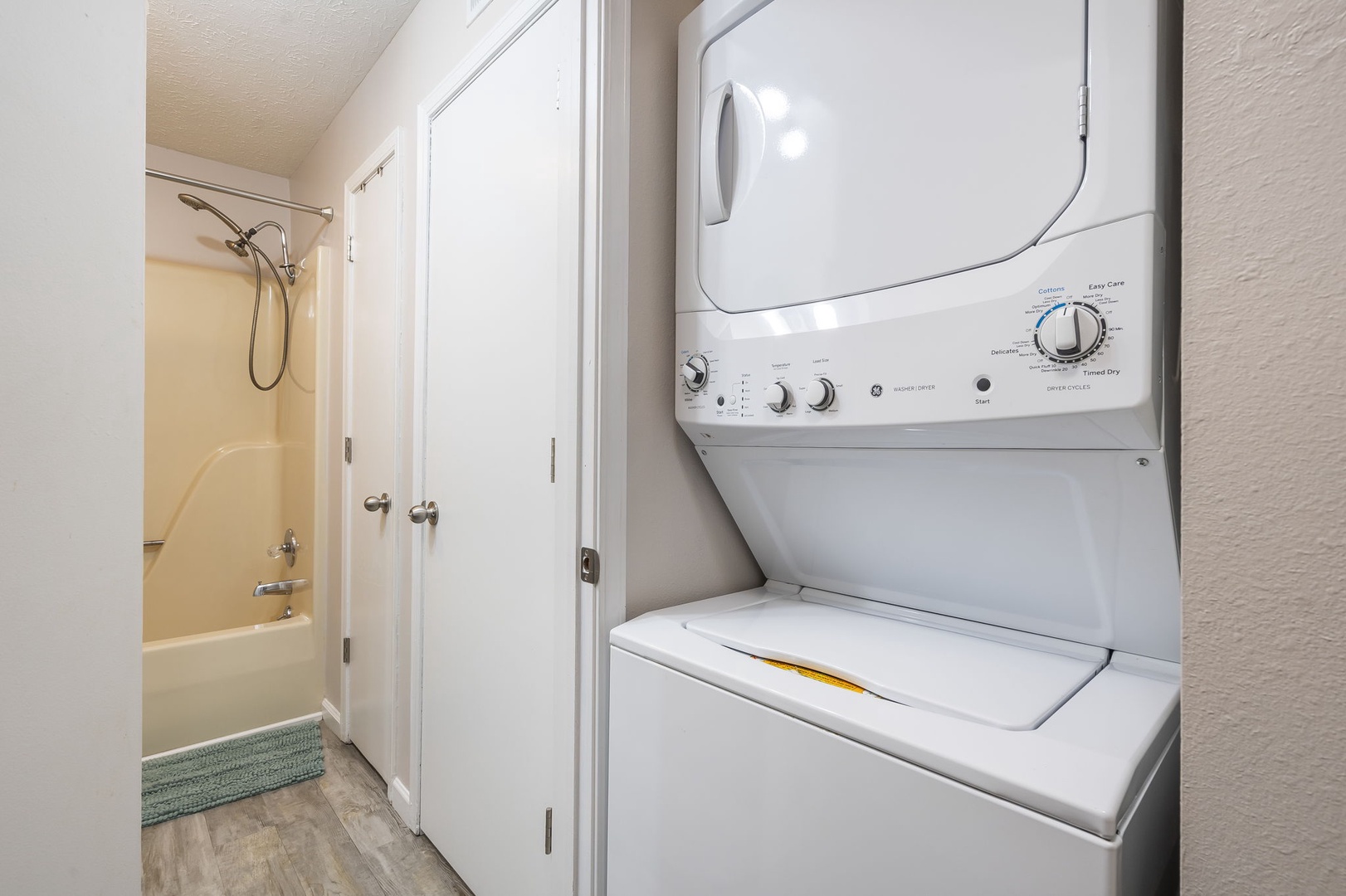 Private laundry is located in the hall between the bedroom & bathroom