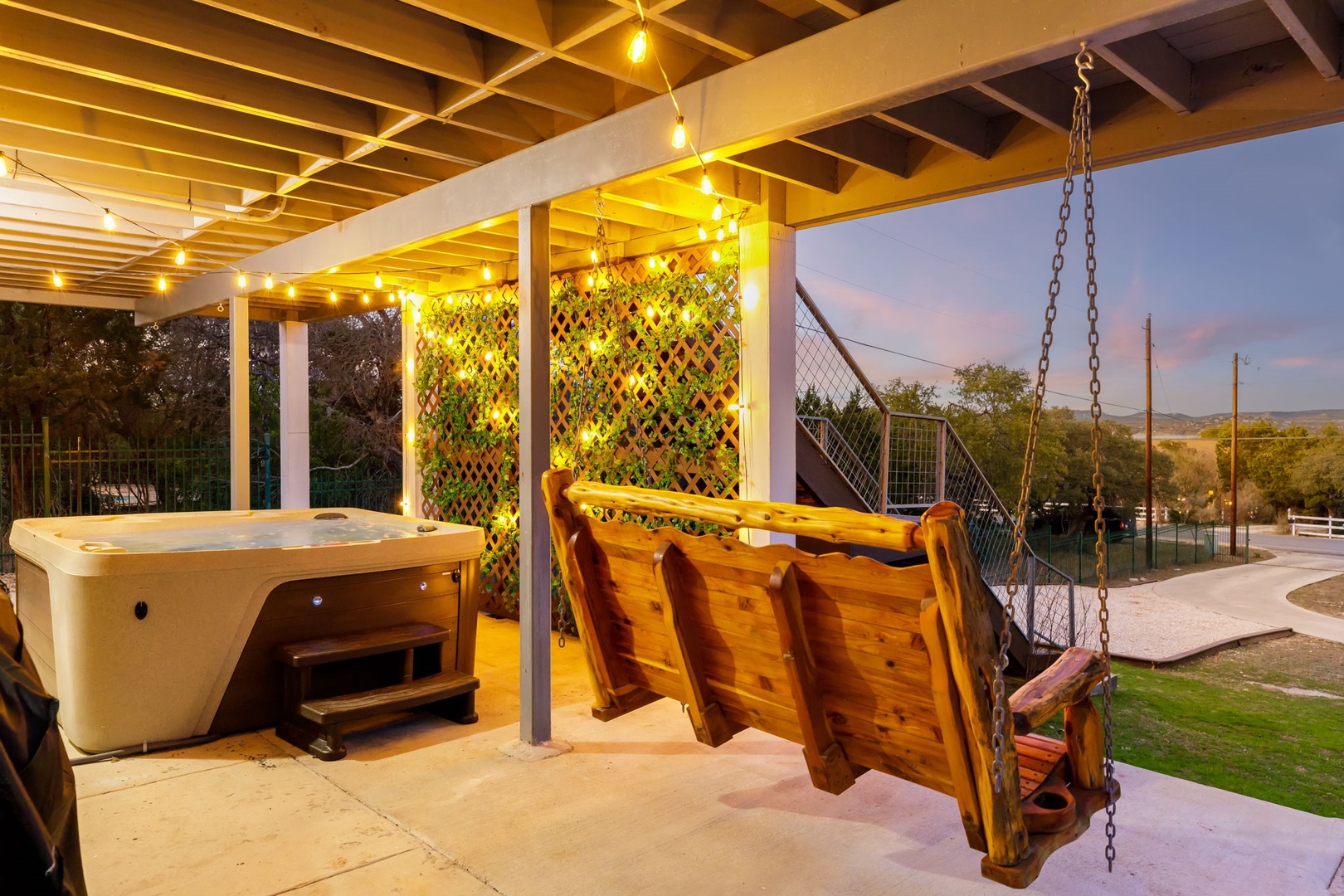 Sway in the fresh air or soak the day away in the hot tub on the lower-level patio