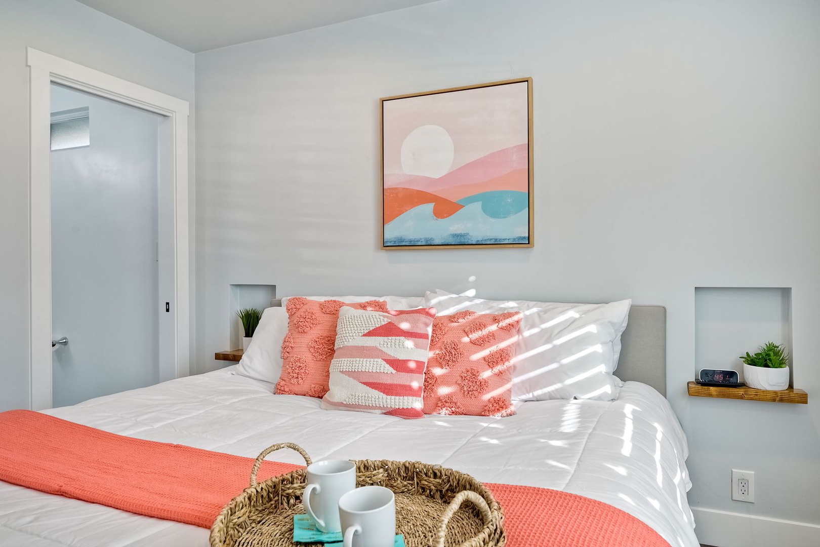 The serene master bedroom offers a private en suite & Smart TV