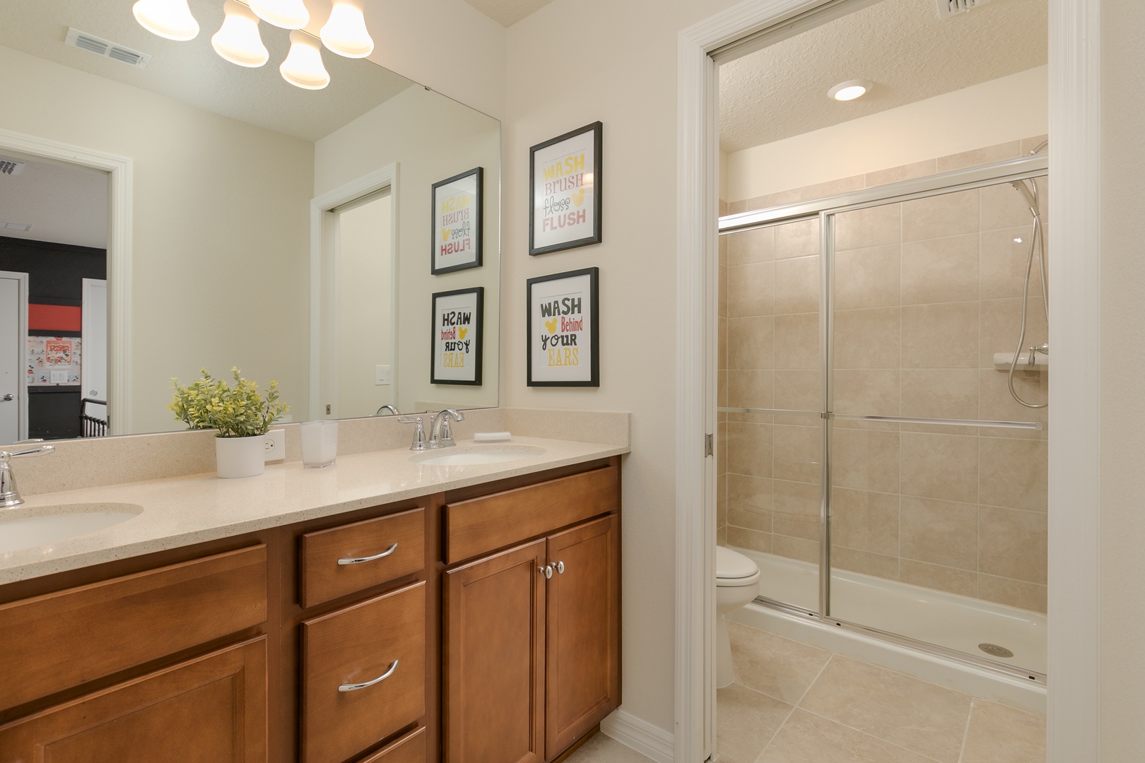 This 2nd floor en suite includes a double vanity & glass walk-in shower