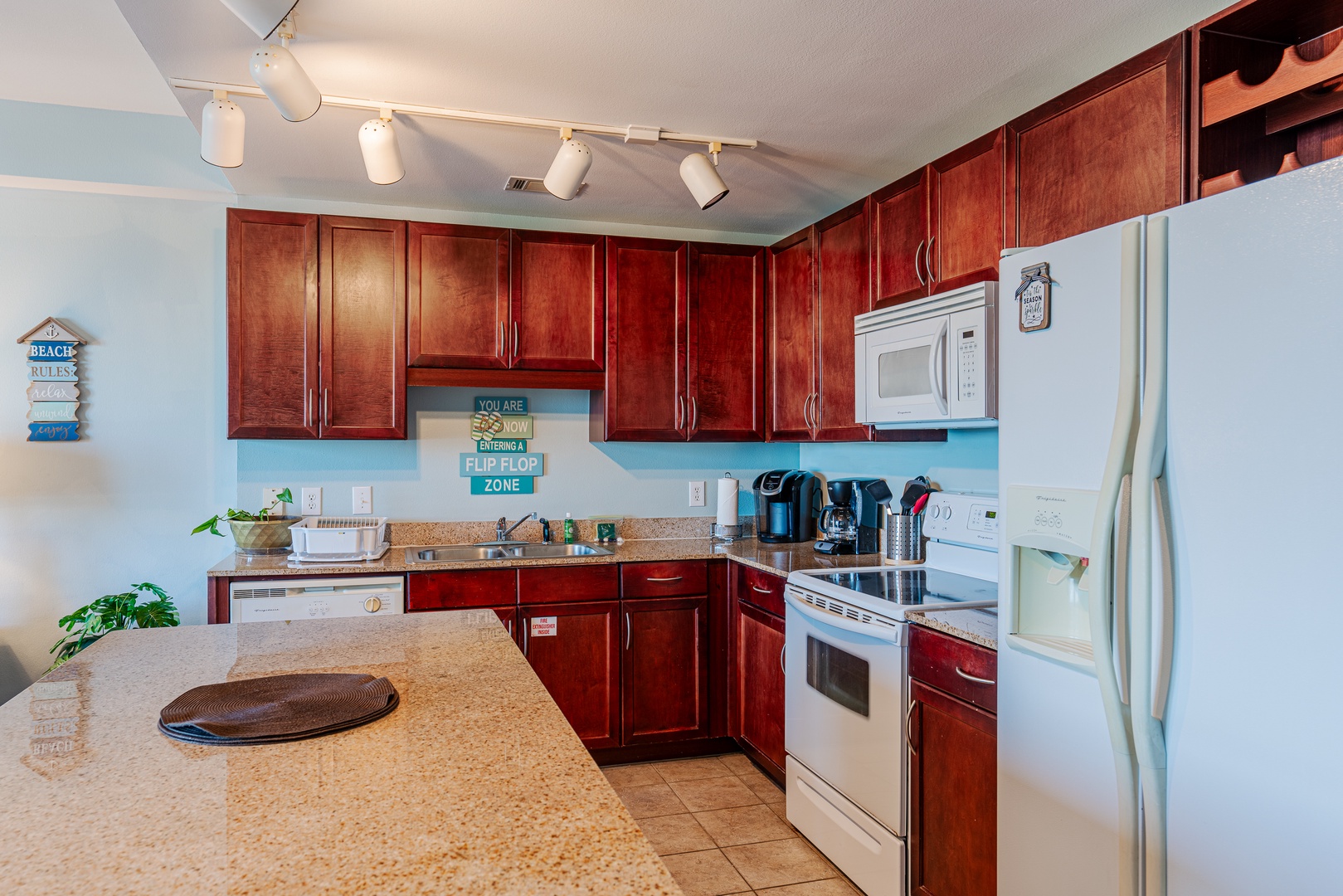 The spacious kitchen offers ample space & all the comforts of home