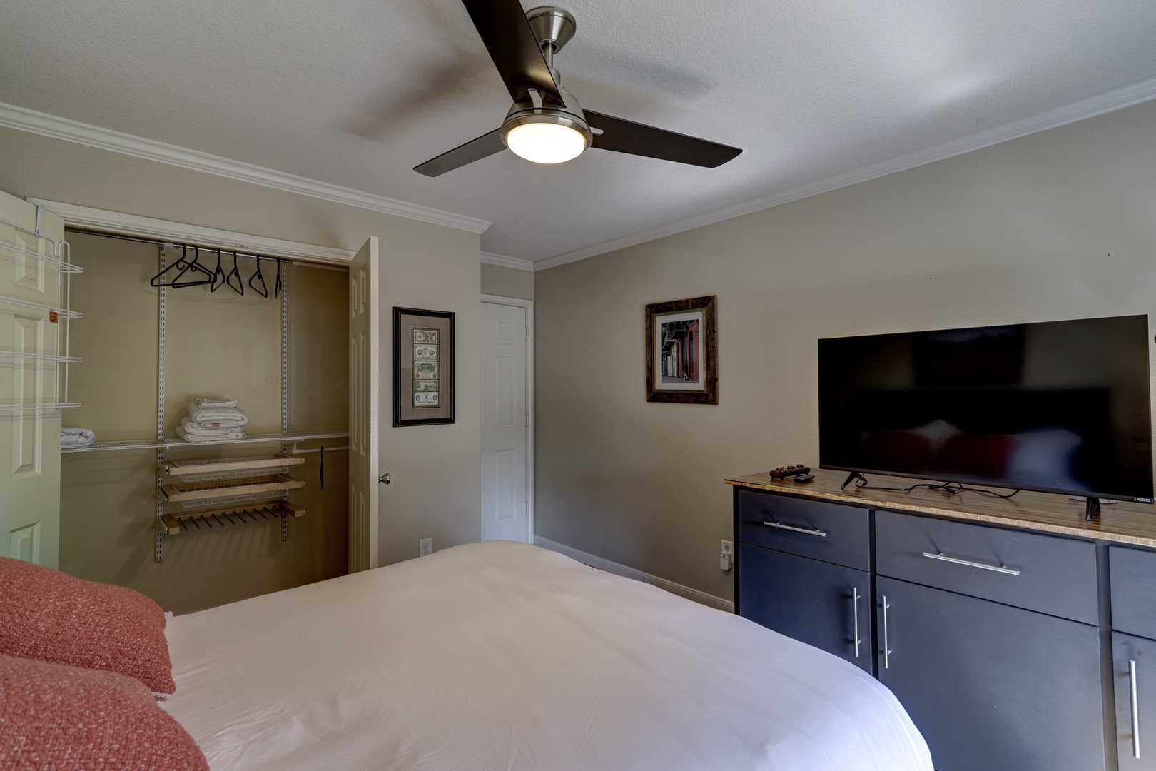 The second bedroom sanctuary boasts a regal queen bed & Smart TV
