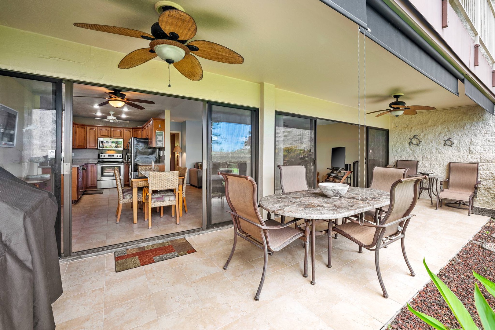 Private lanai with garden view, BBQ, and patio seating