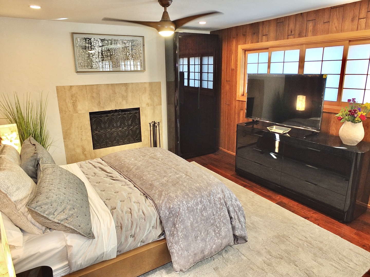 Bedroom 2 with queen bed, fireplace, and Smart TV