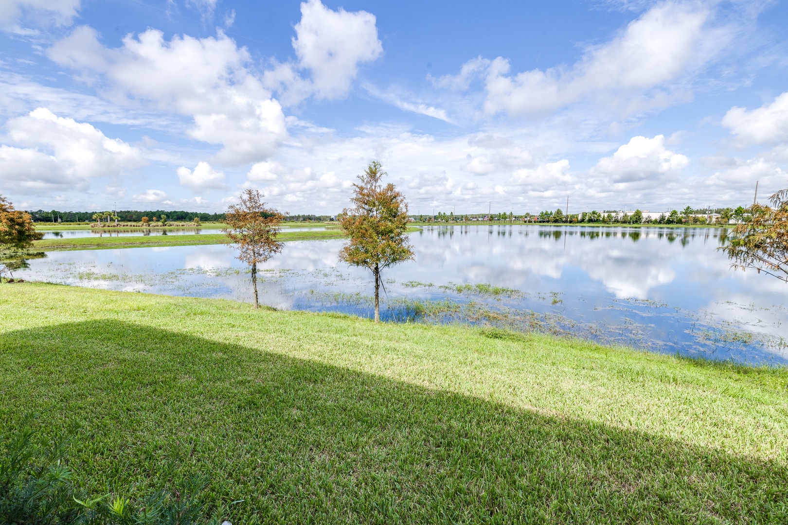 Relax with a drink on the covered back patio while enjoying the waterfront view