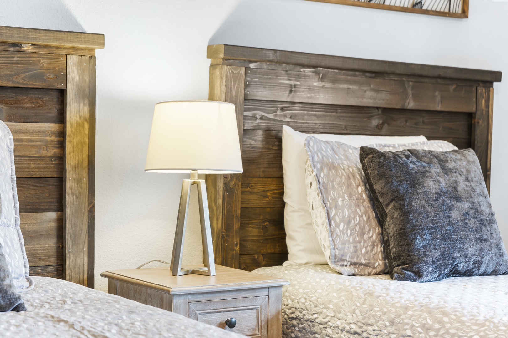 This cozy bedroom retreat offers a pair of twin beds, private ensuite, & TV