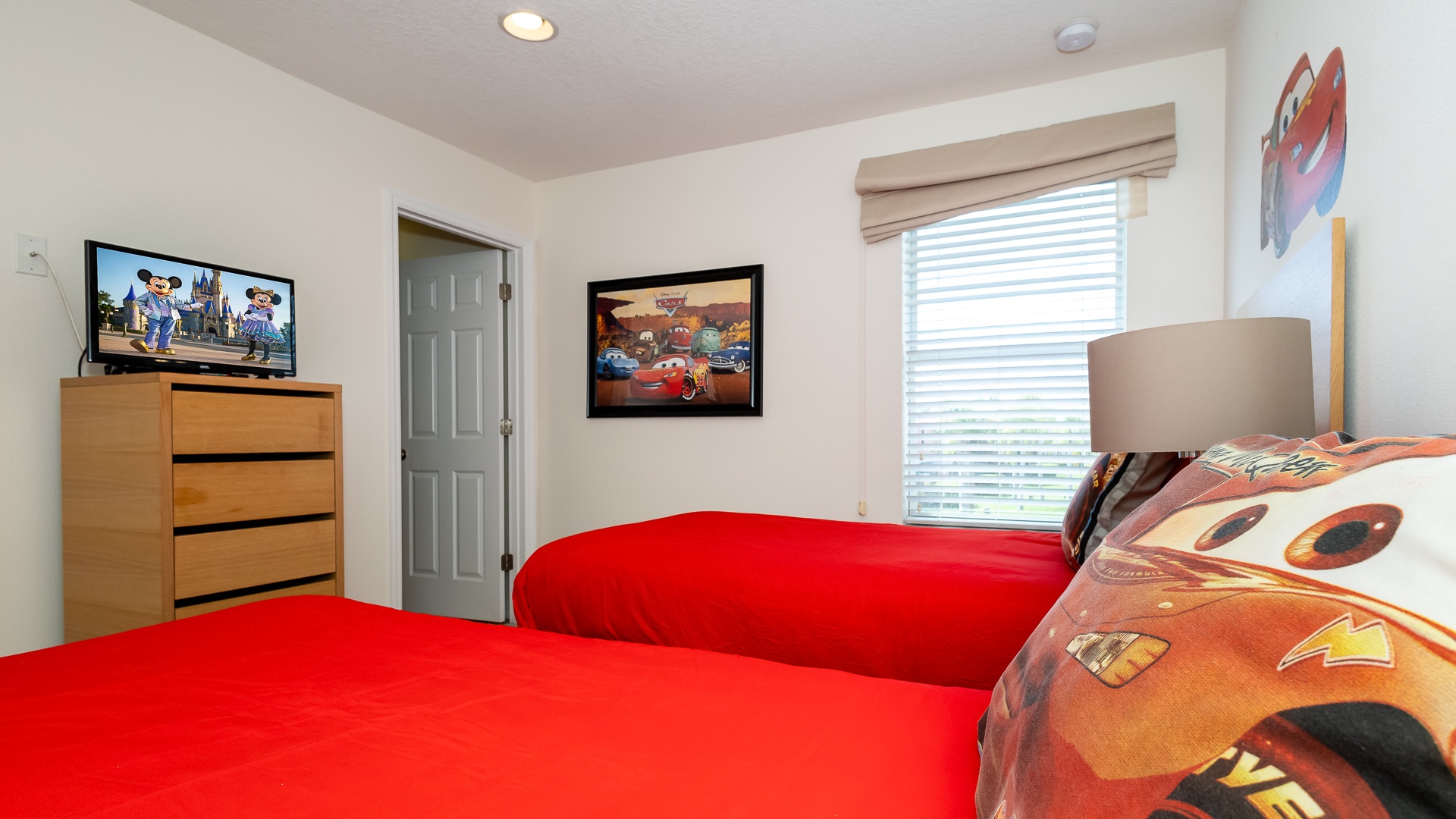 The second of two bedrooms offers a pair of twin beds, en suite, & Smart TV