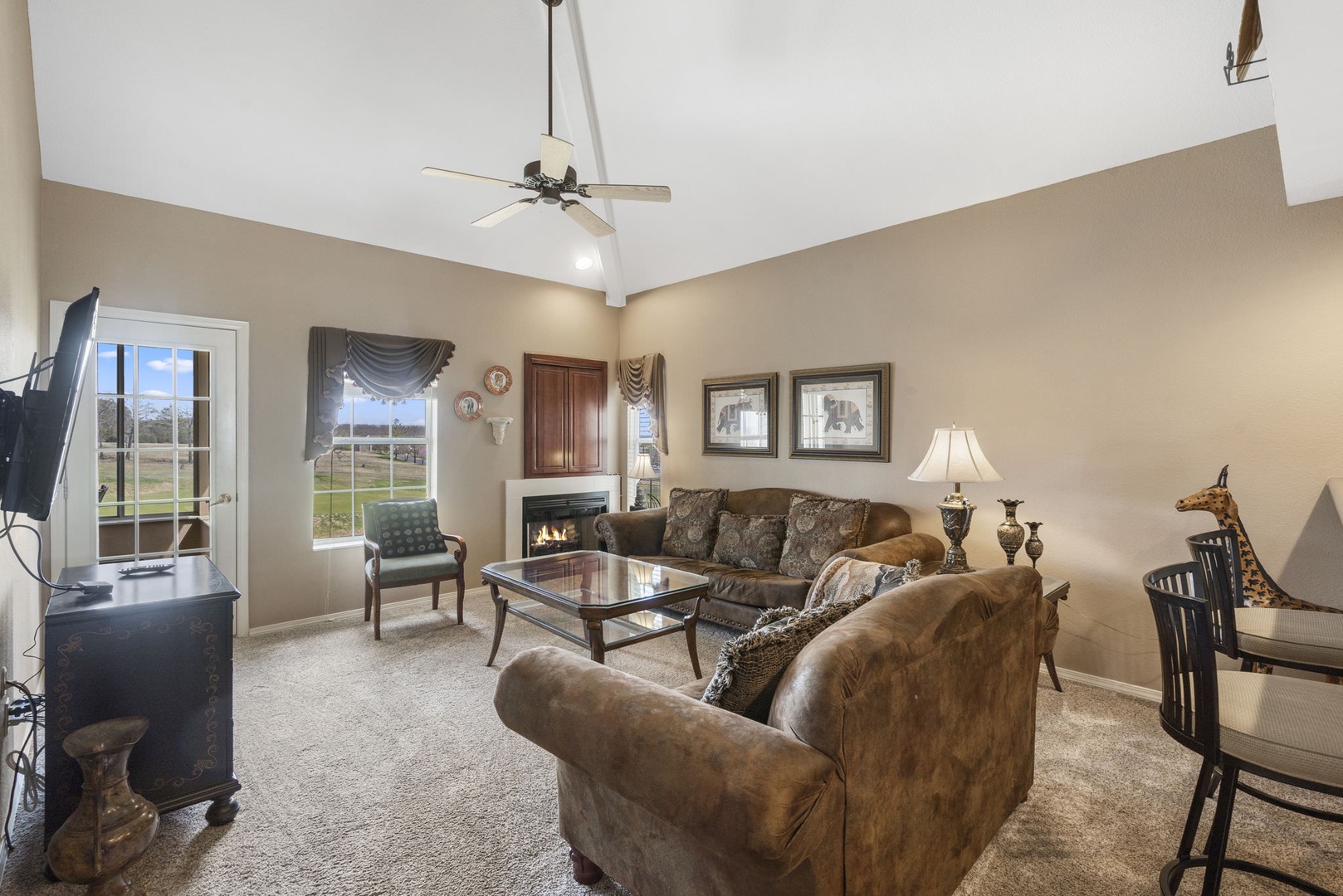 Cozy and spacious living area with TV