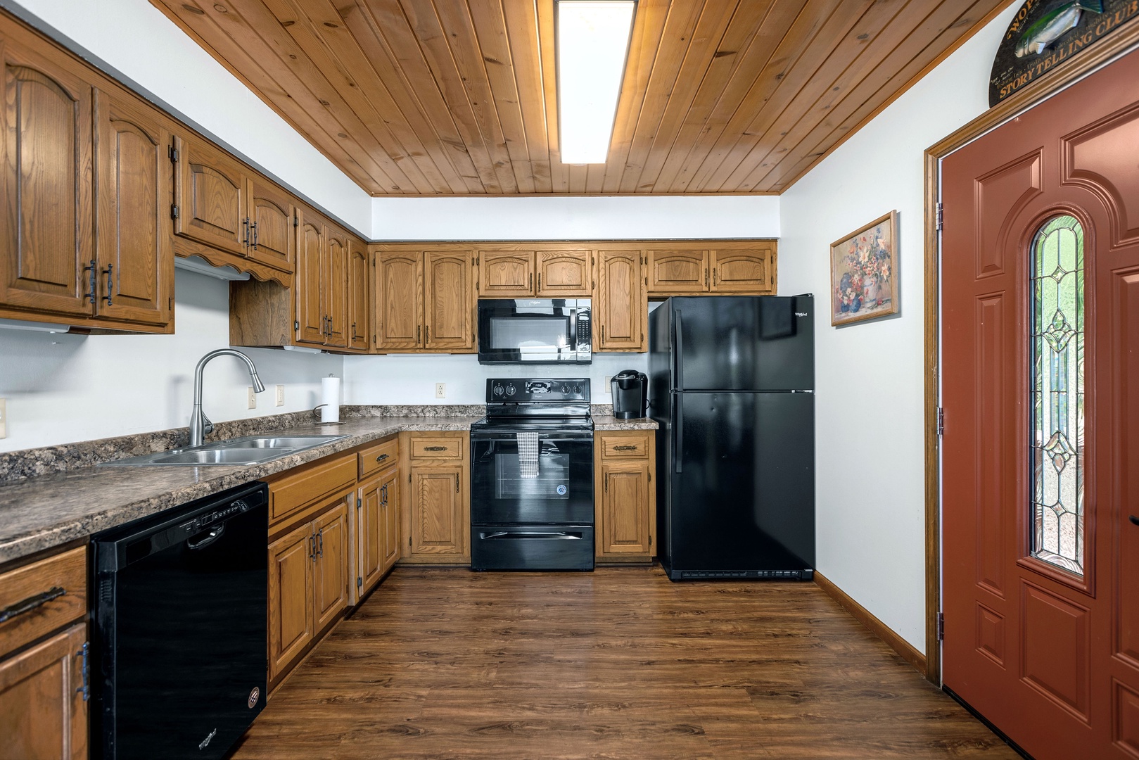 The open kitchen offers ample space & all the comforts of home