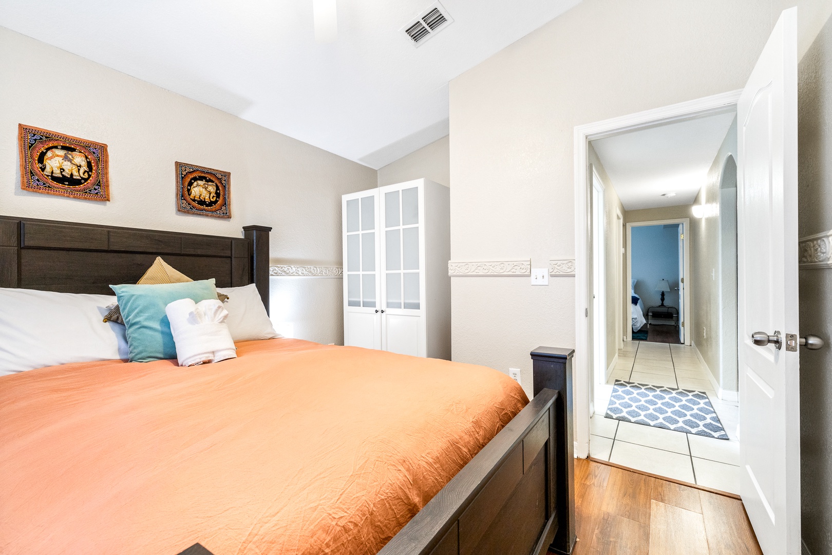 The 1st of 3 serene bedrooms, boasting a plush queen-sized bed