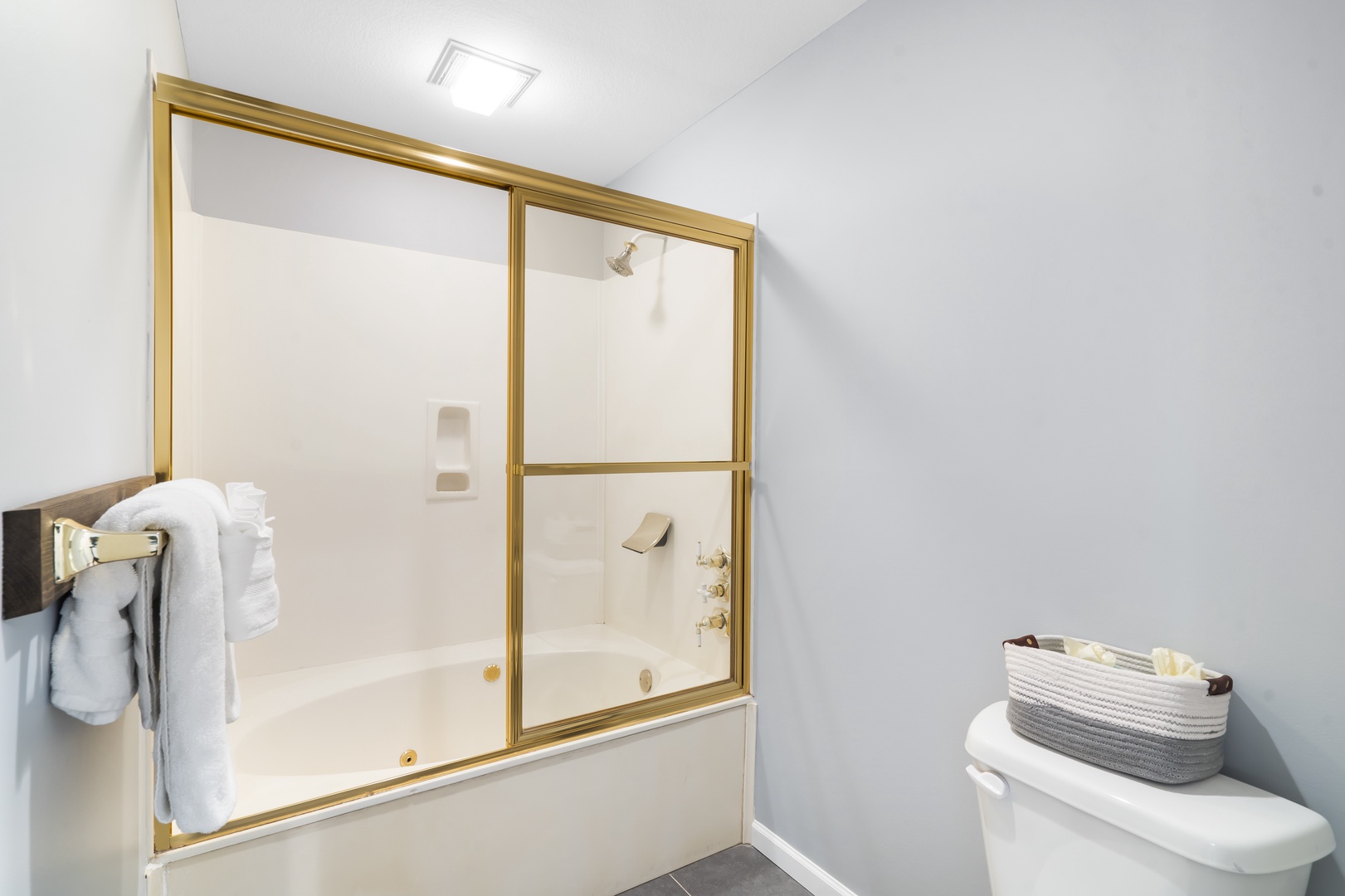 Dual vanities & a shower/tub combo await in the master ensuite bath