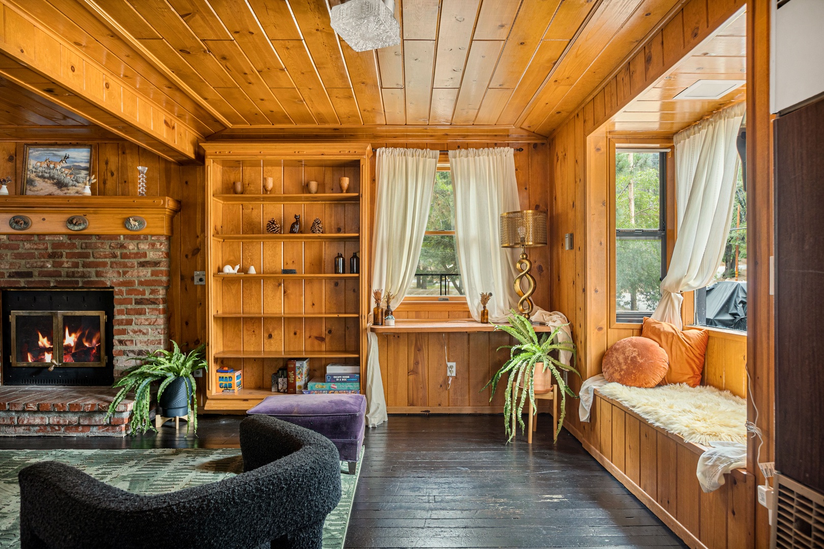 Living area with ample seating, Smart TV, and fireplace