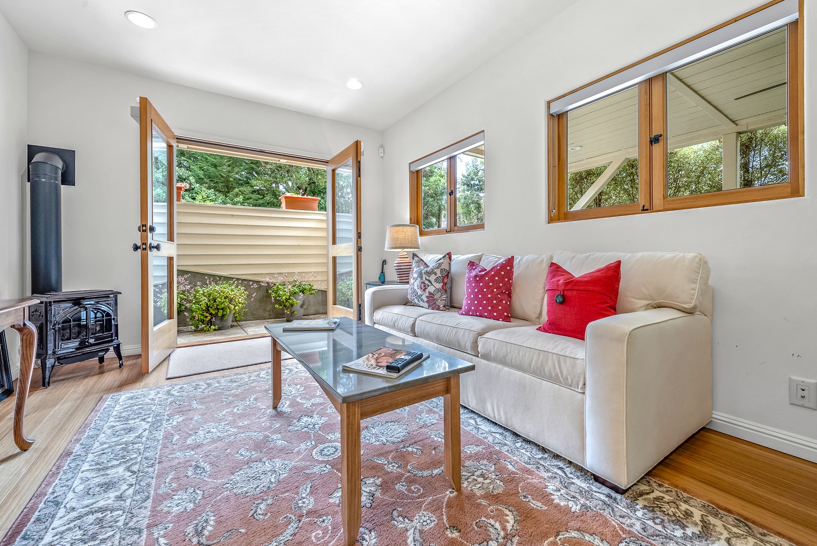 Bright living area with cozy seating and Smart TV