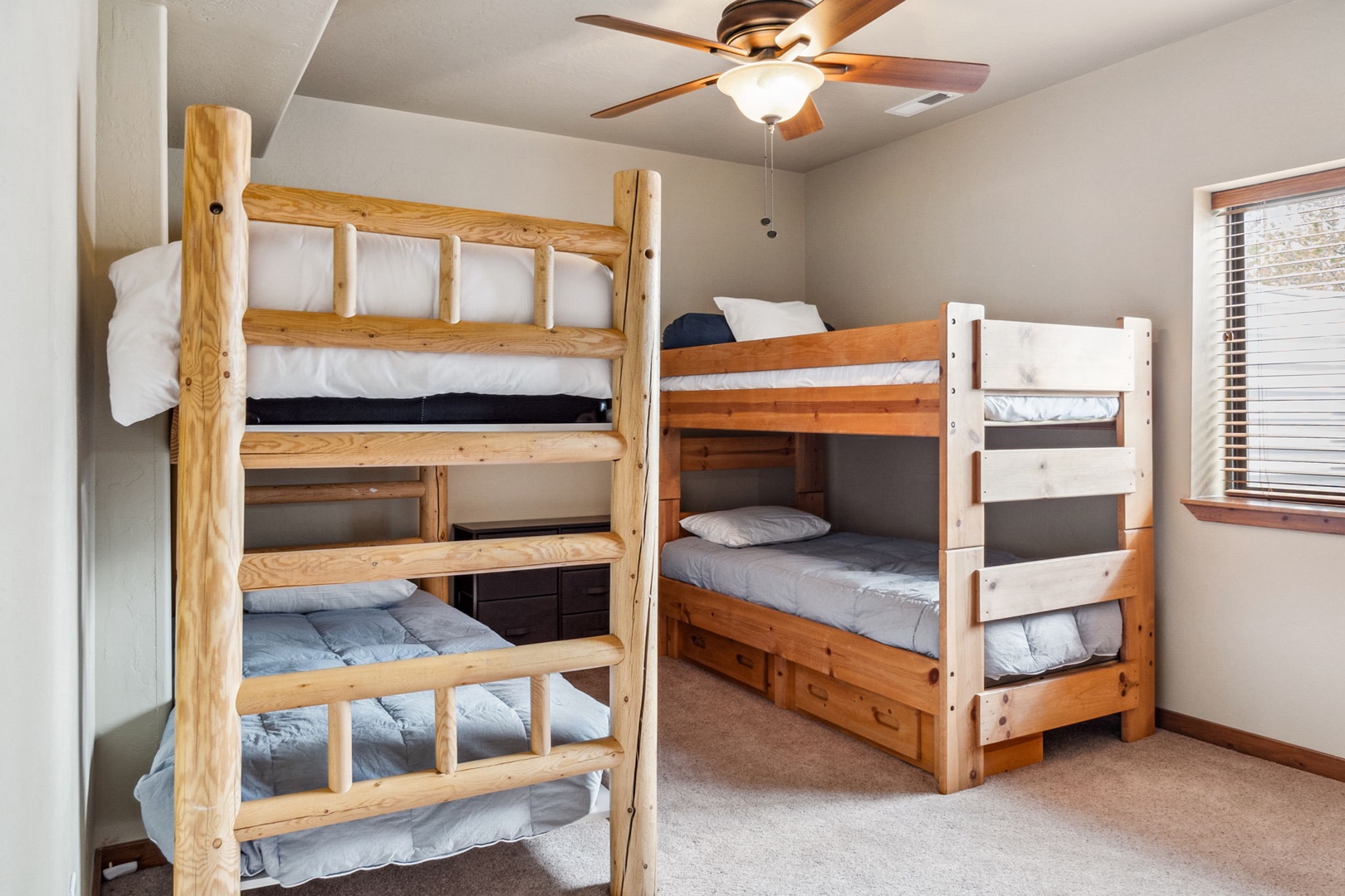 This lower-level bedroom offers a pair of cozy twin bunkbeds