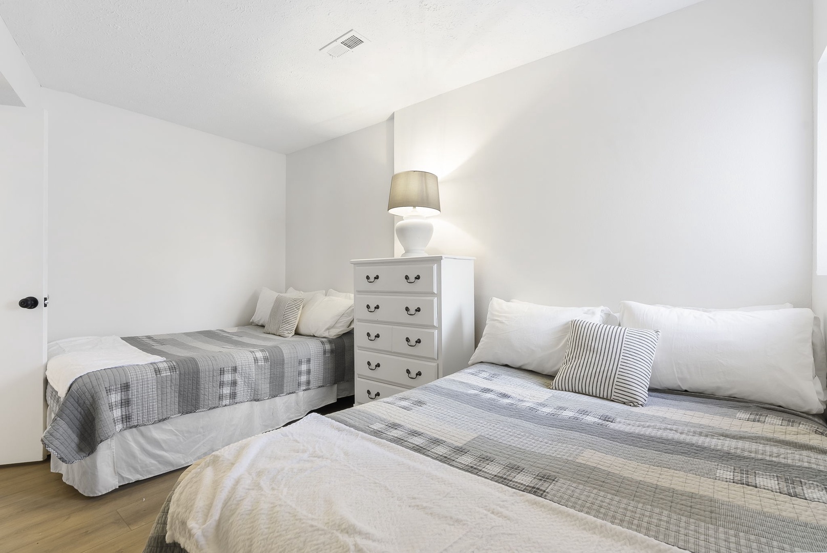 Unit 45: This 1st floor bedroom includes a pair of cozy full-sized beds