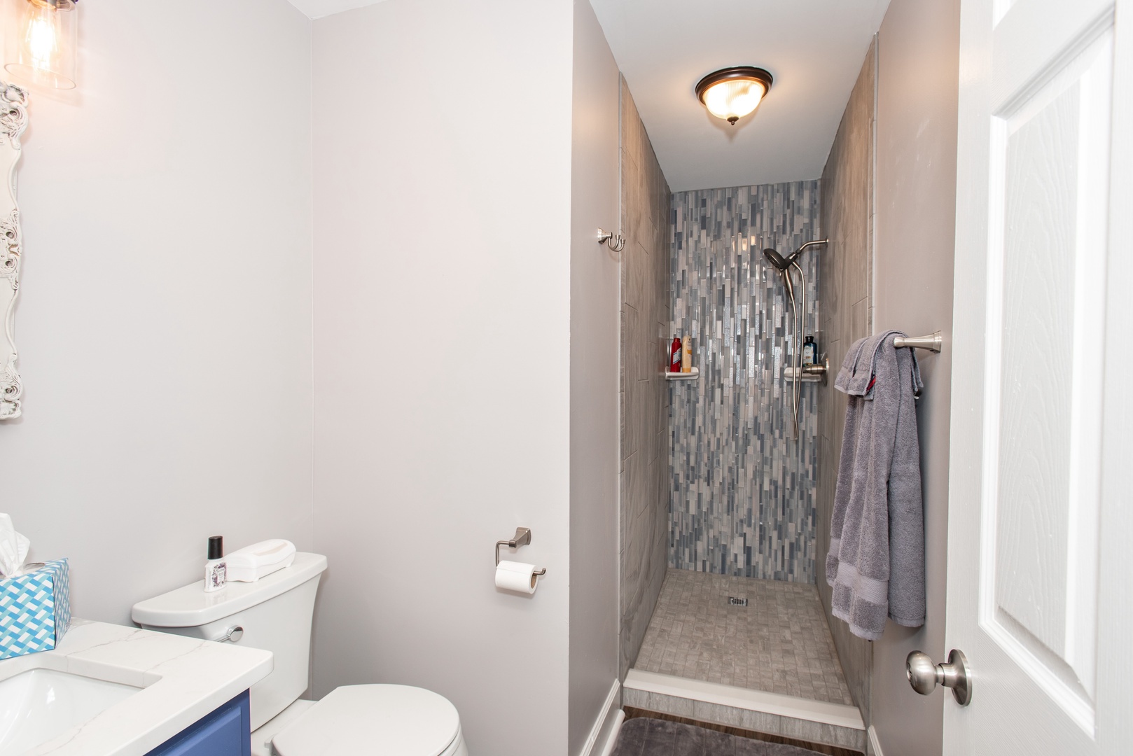Apt 1 – The full bathroom includes a single vanity & walk-in shower