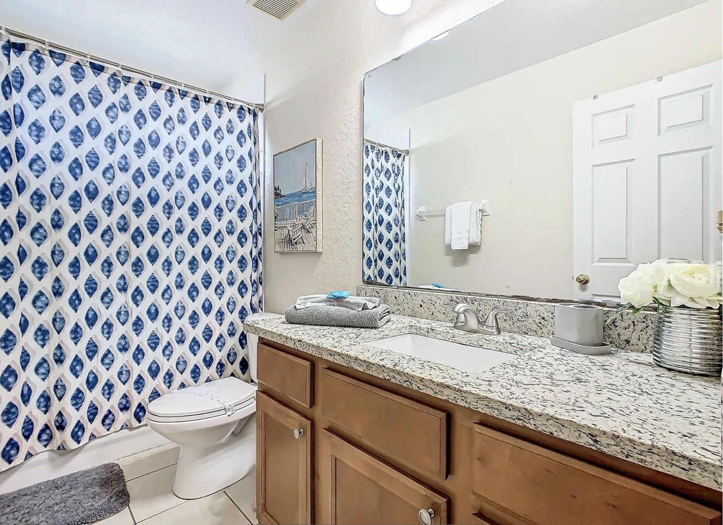 Shared bathroom with shower/tub combo