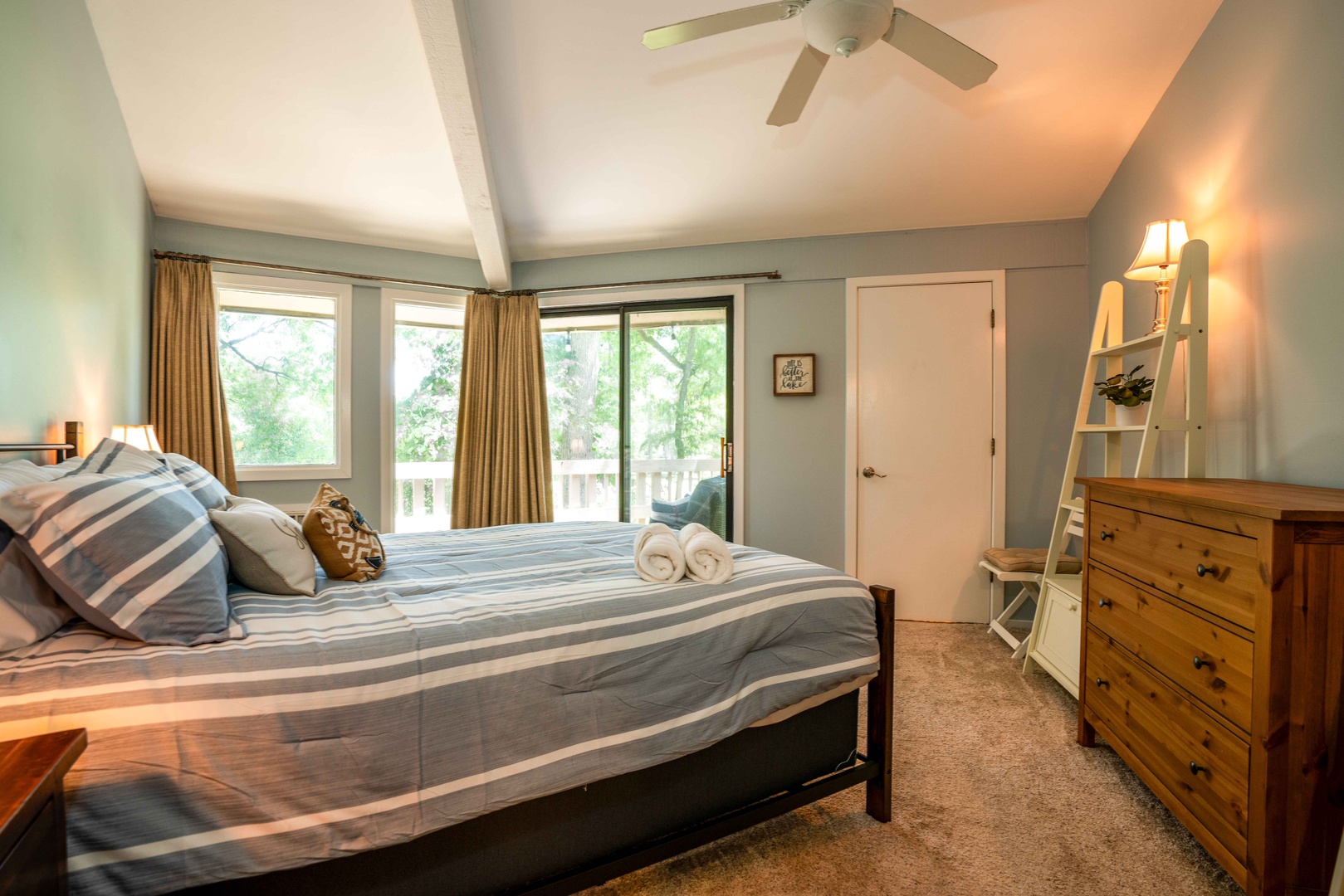 Bedroom with queen bed, and deck access