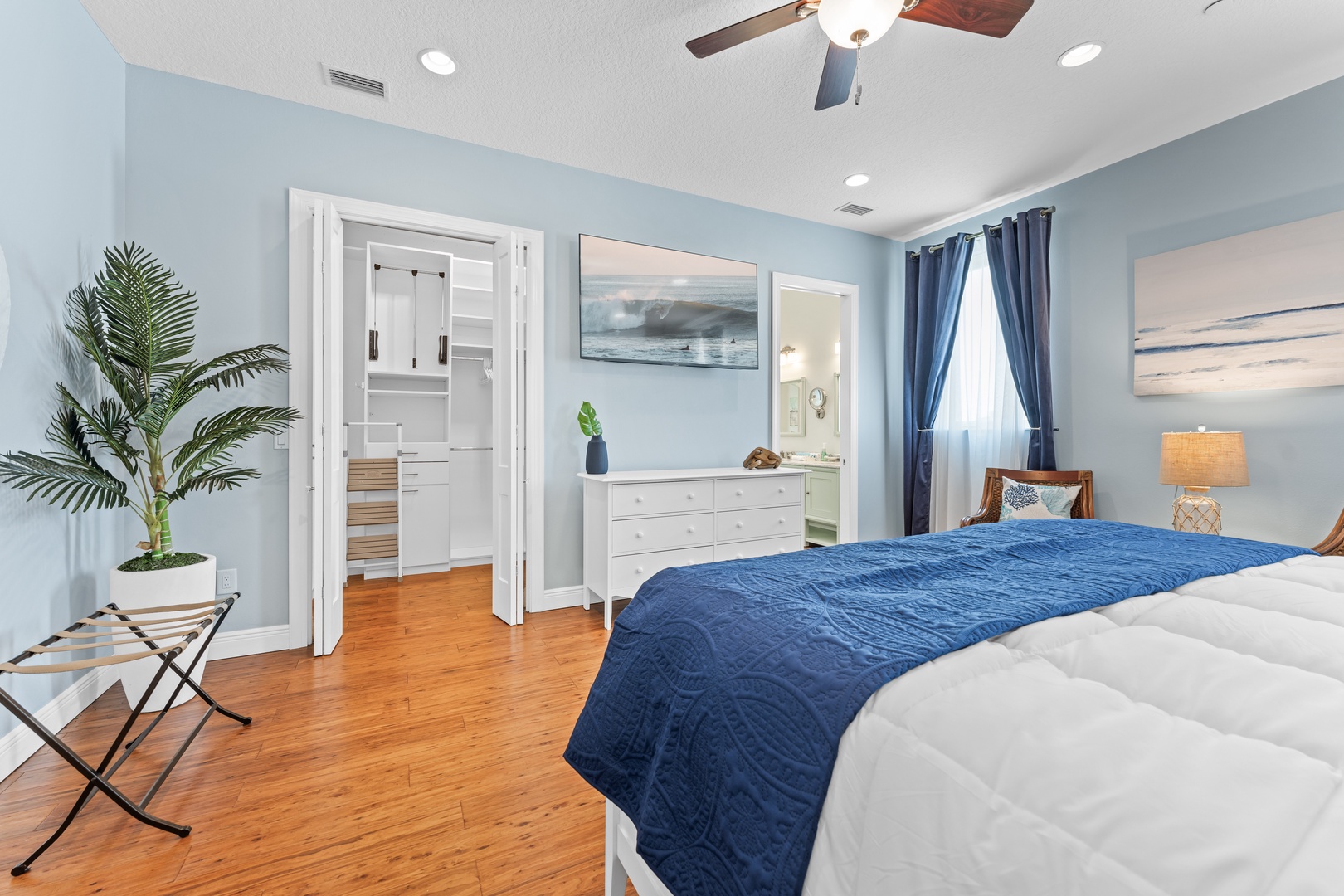 Bedroom 1 with king bed, TV, and ensuite