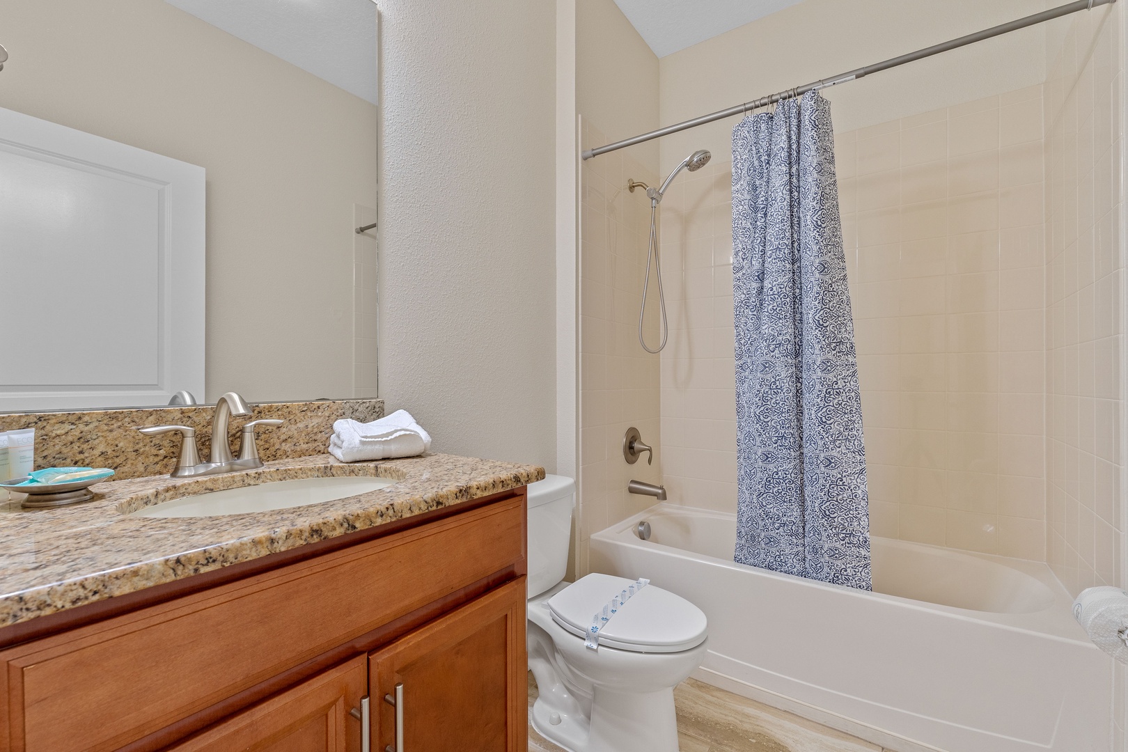 Shared bathroom with shower/tub combo