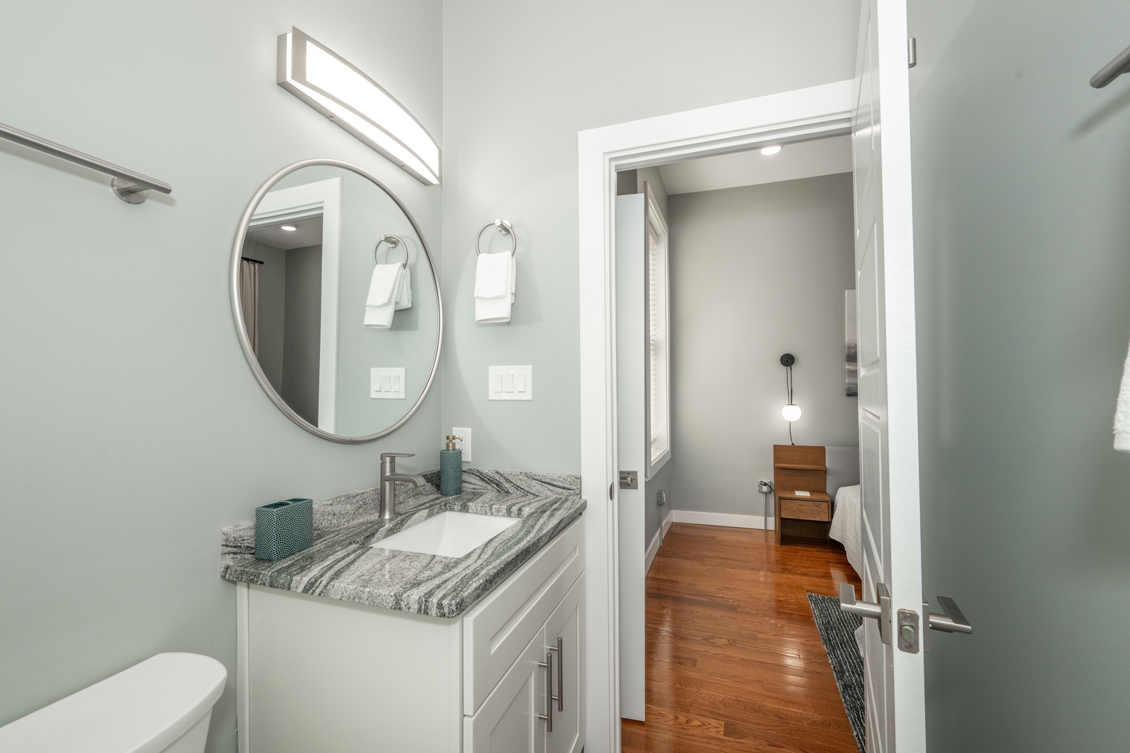 This ensuite bath includes a single vanity & shower/tub combo