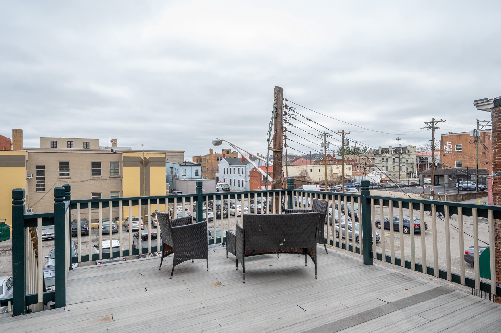 Enjoy views of charming city buildings from the back deck