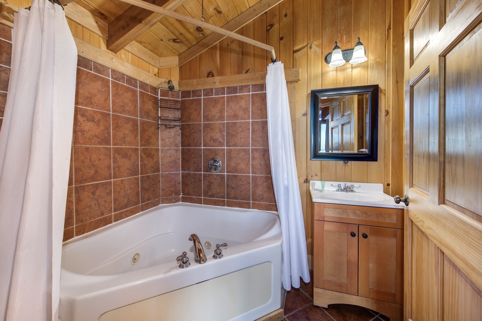 The loft ensuite offers a single vanity & shower/Jacuzzi tub combo