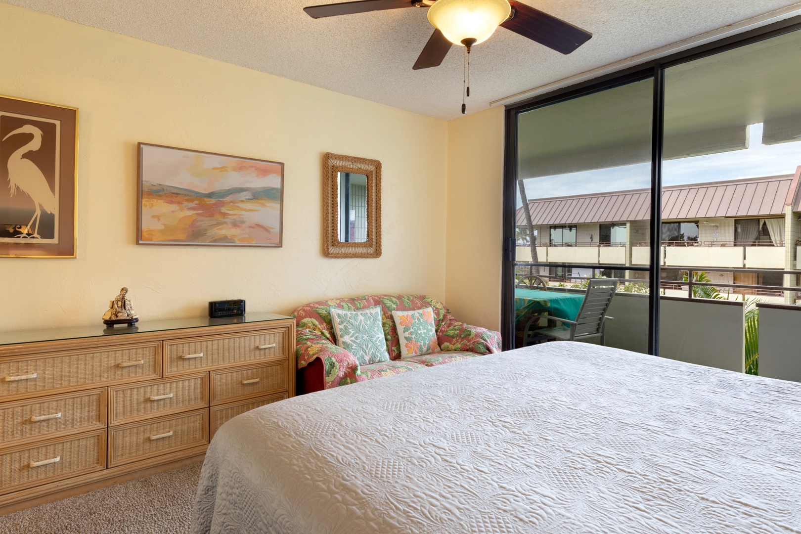 Primary Bedroom with King bed, lanai access, and ensuite