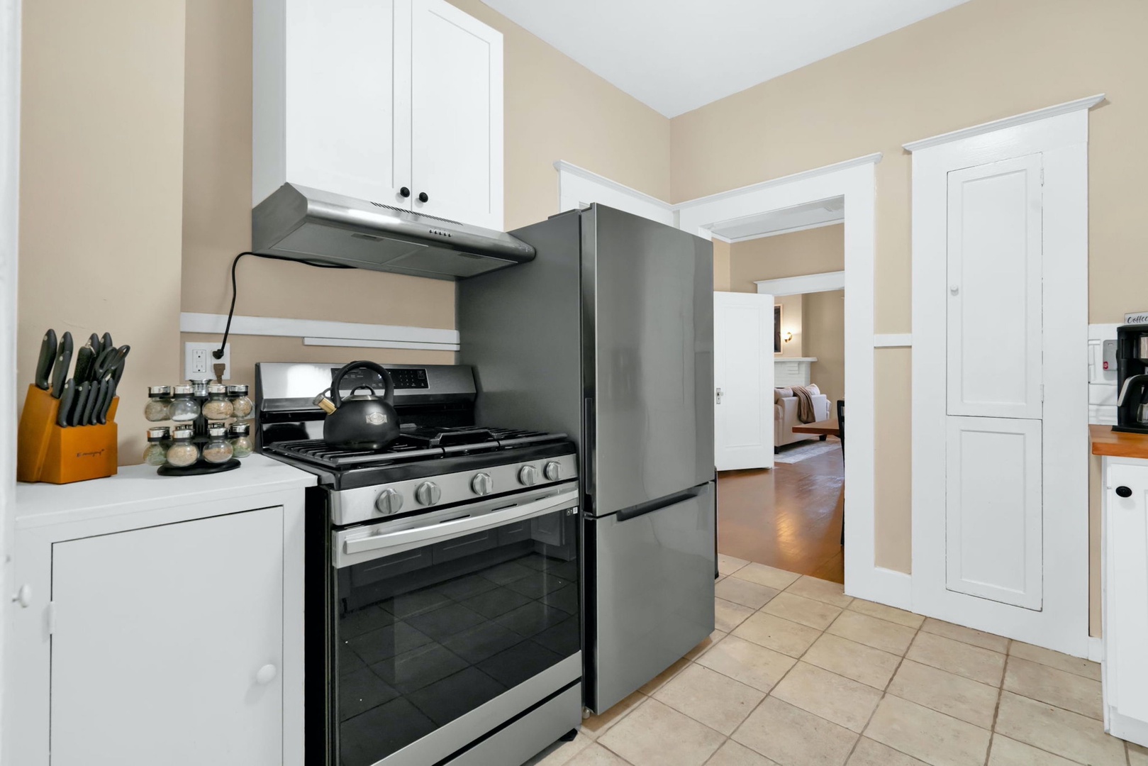 The welcoming kitchen provides ample space & all the comforts of home