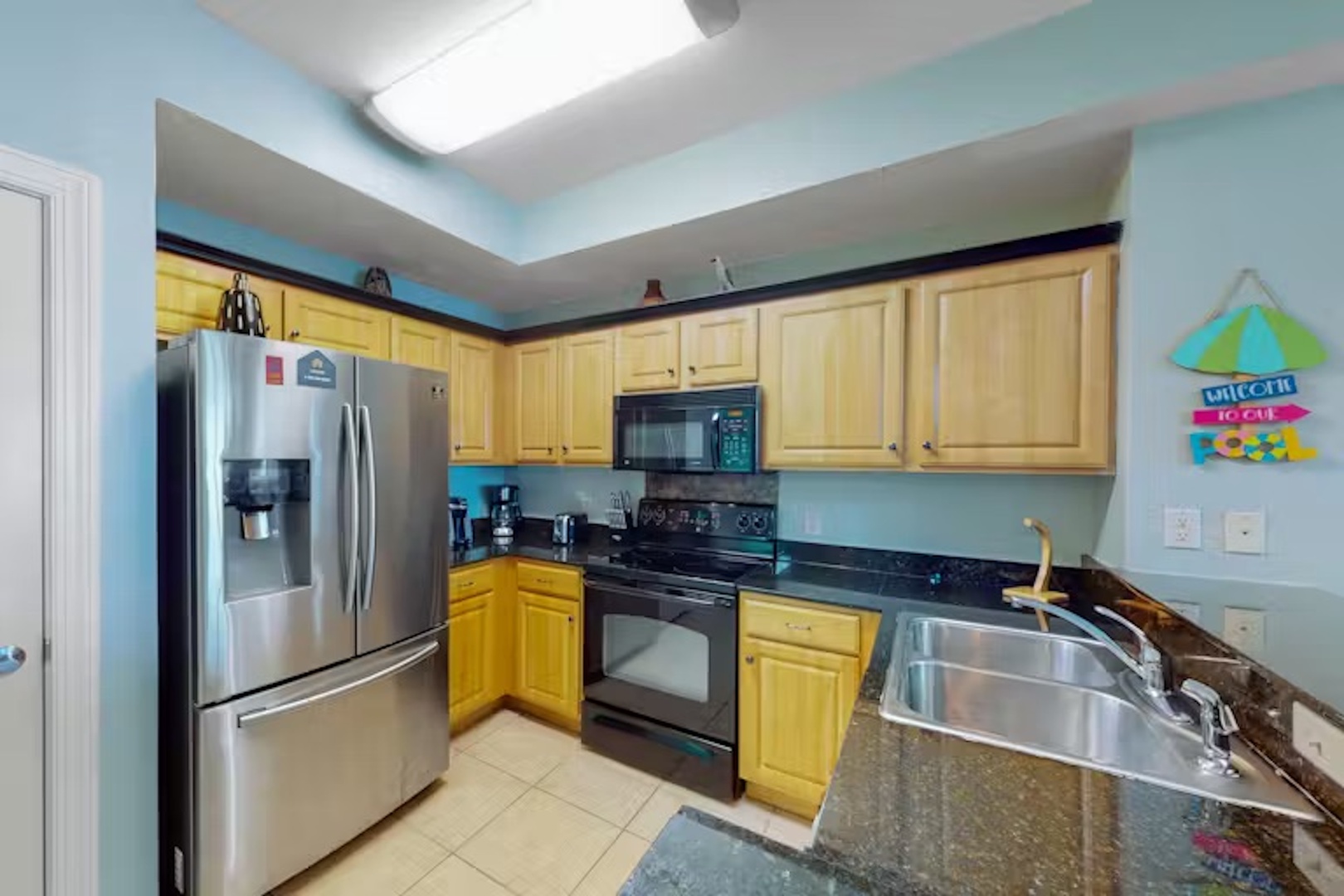 The open, airy kitchen offers ample space & all the comforts of home