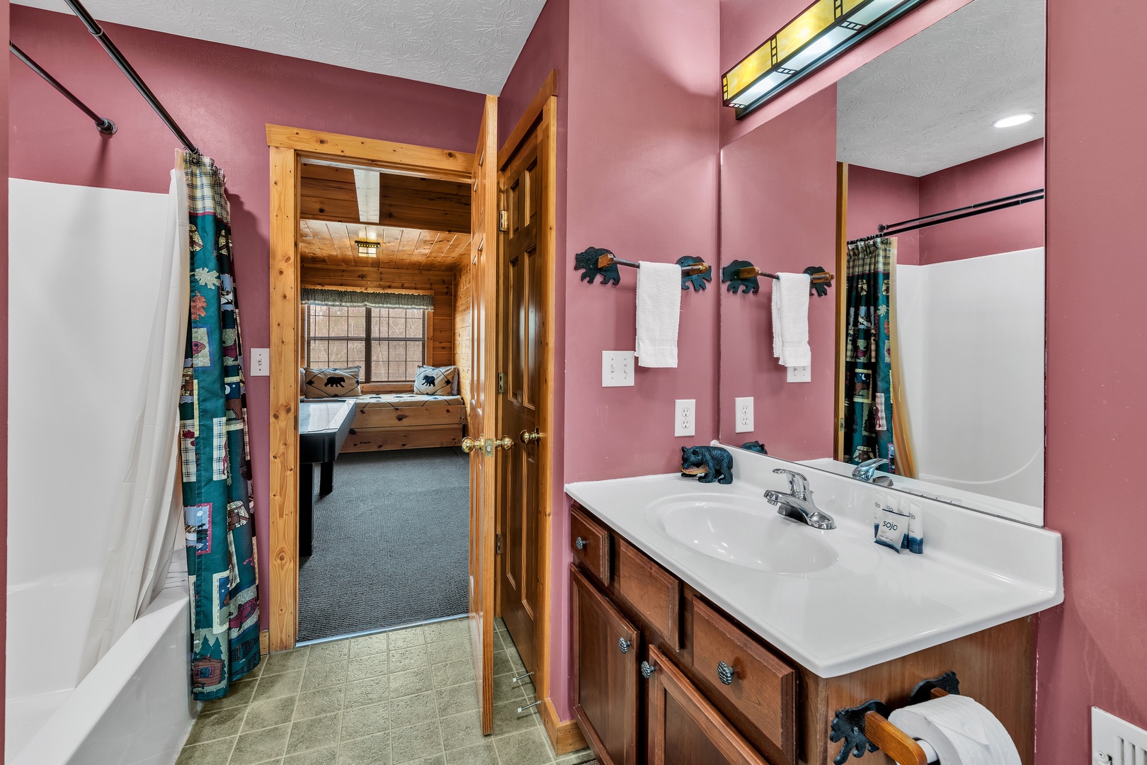 The loft’s full bathroom features a single vanity & shower/tub combo