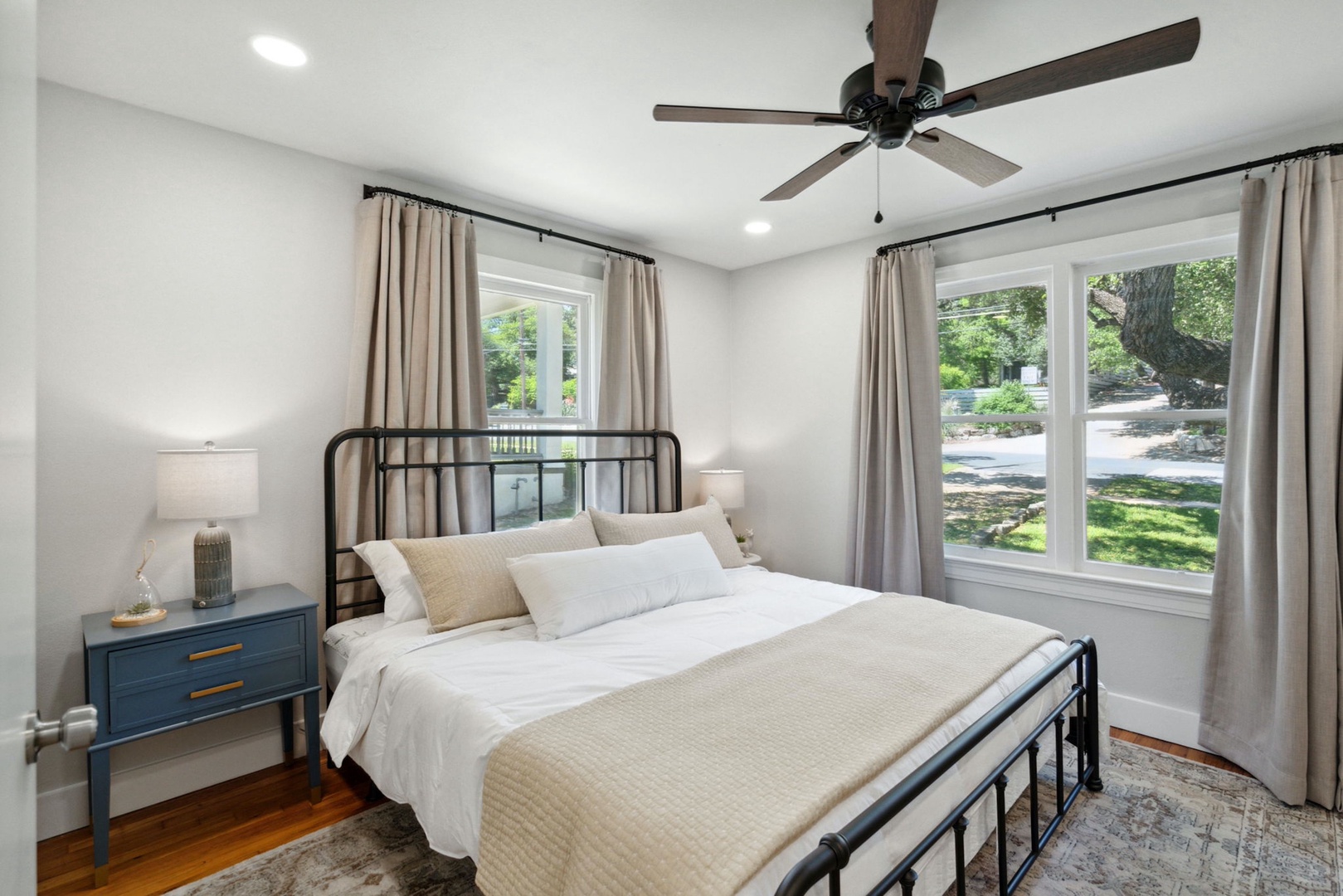The second bedroom boasts a plush king-sized bed & Smart TV