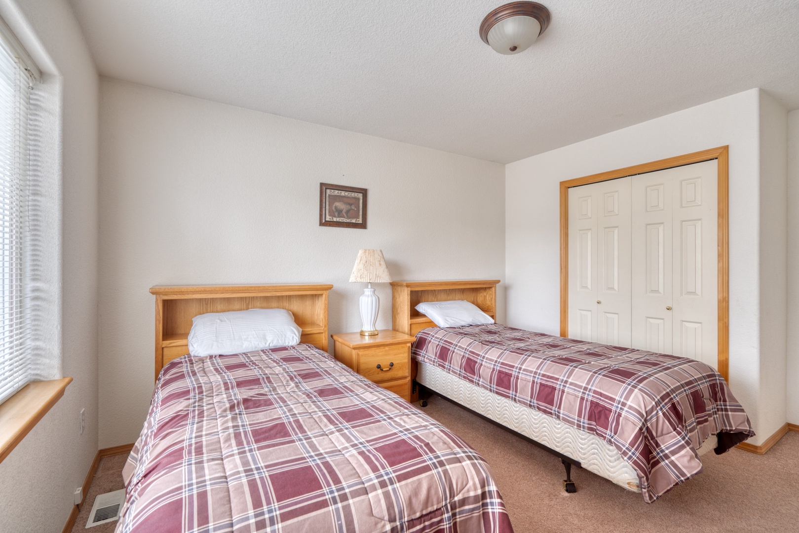 Enjoy an afternoon nap in the third bedroom, with 2 twin beds & a smart TV