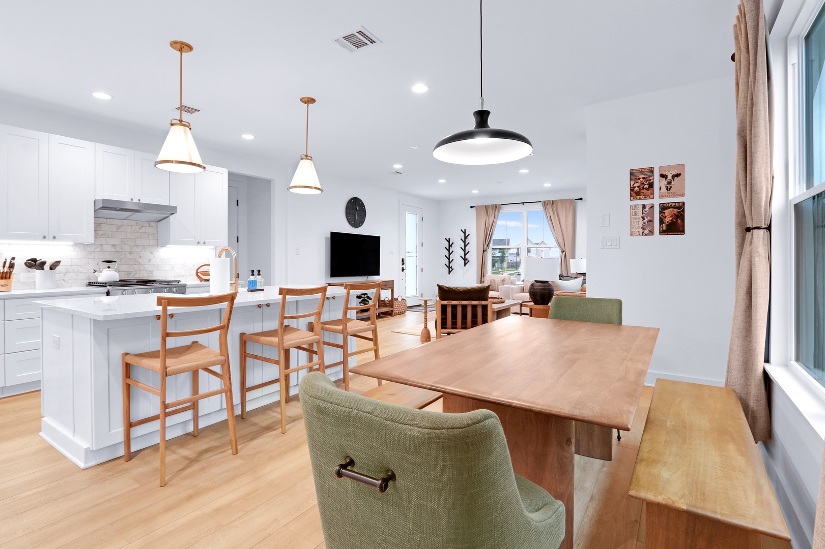 Gather for meals together at the dining table or sip coffee at the kitchen island