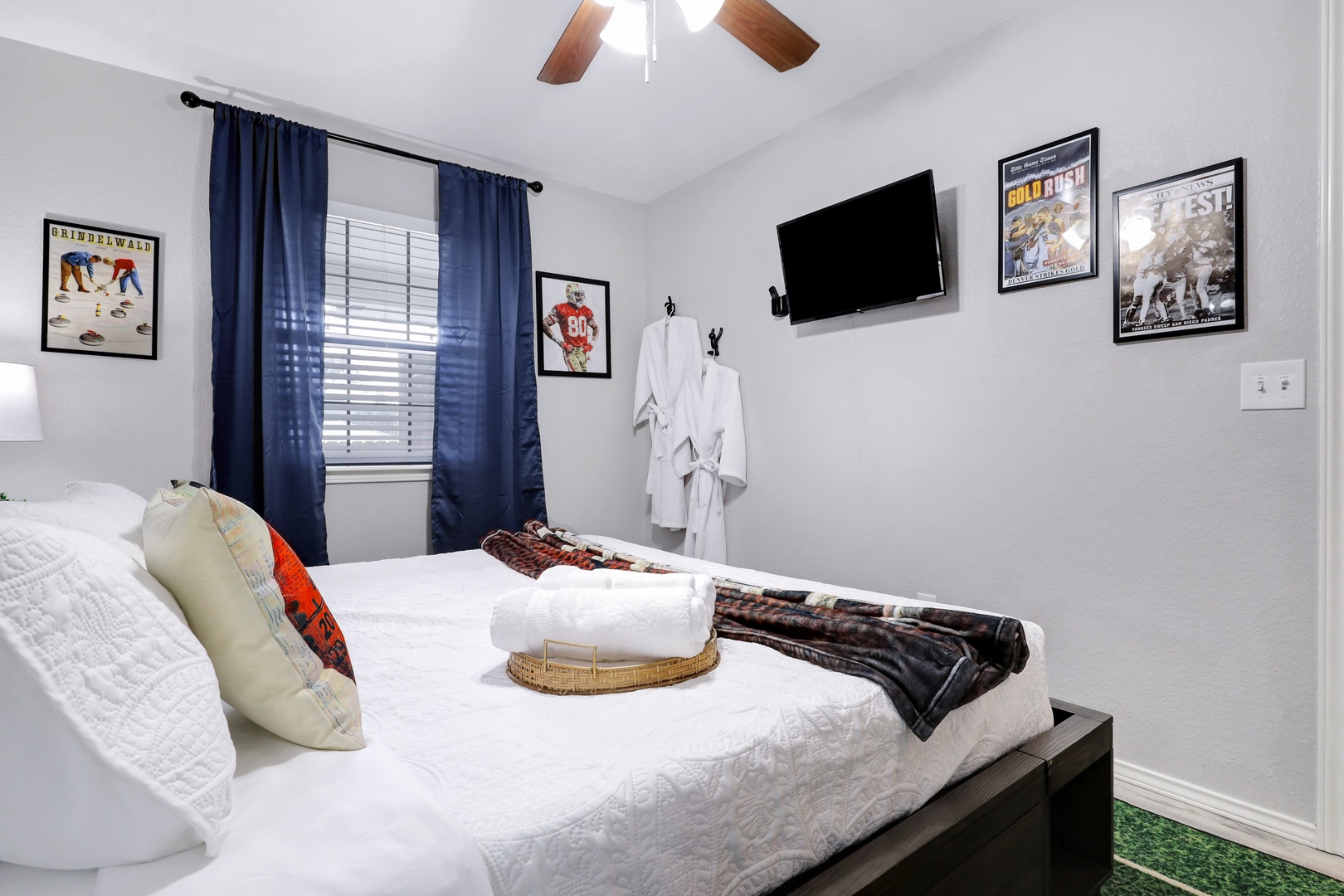 Sports-themed luxury bedroom retreat with a king bed & Smart TV