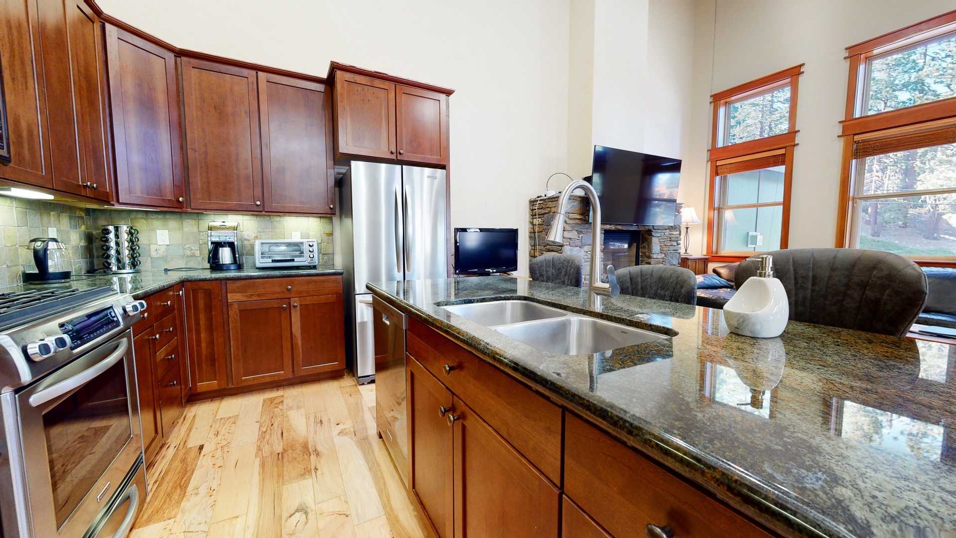 Kitchen with drip coffee maker, blender, dishwasher, gas stovetop and more