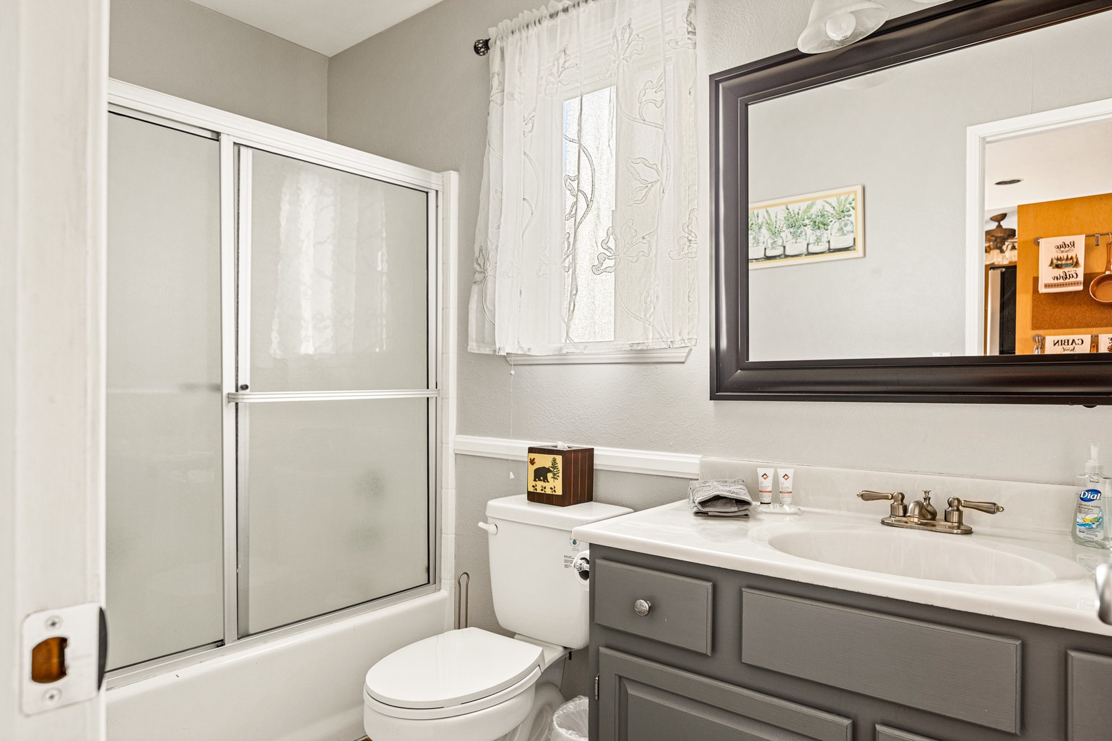 A full bath near the game room offers a single vanity & shower/tub combo
