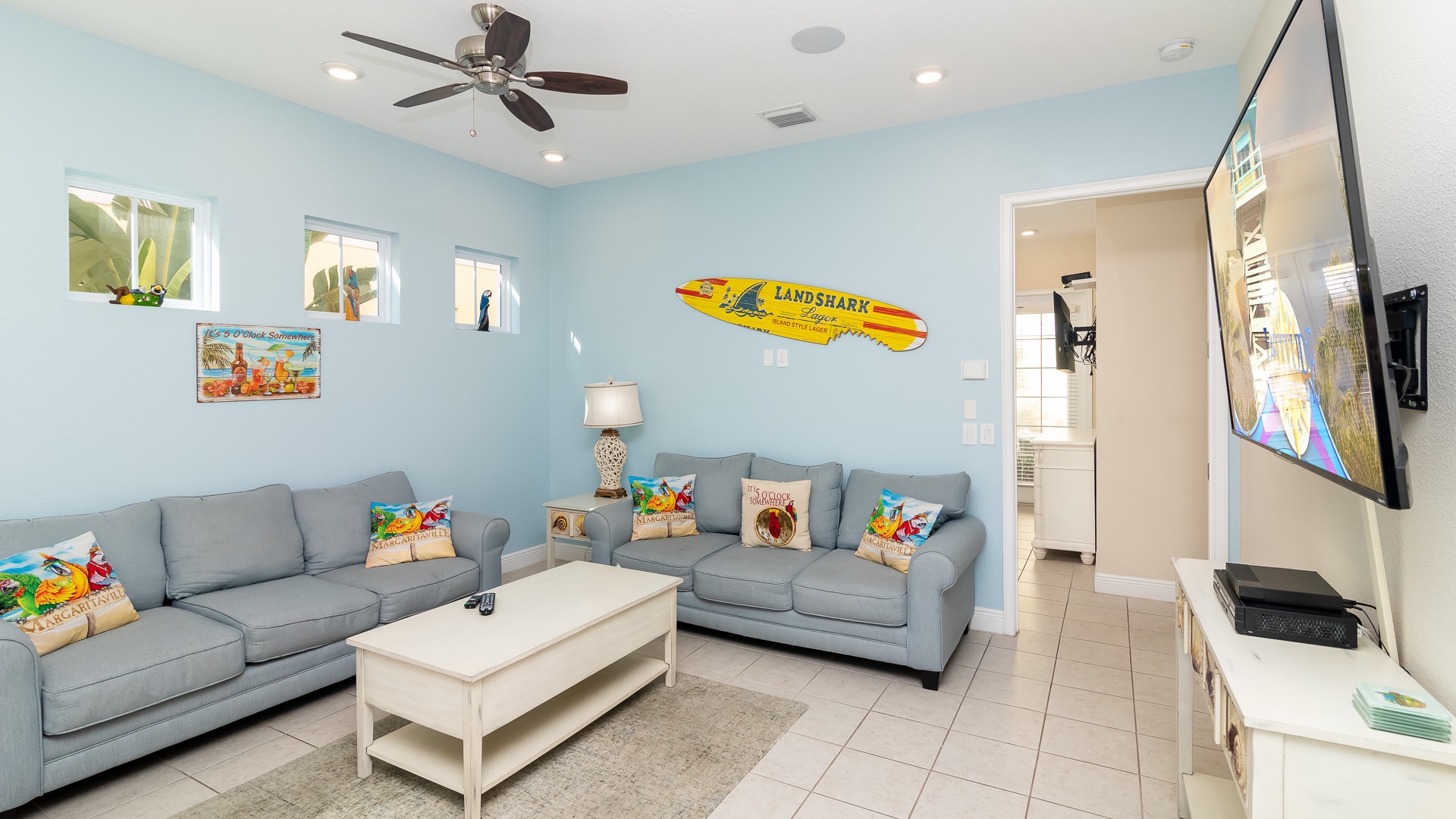 Enjoy a family movie night in the living room with ample seating and a smart TV