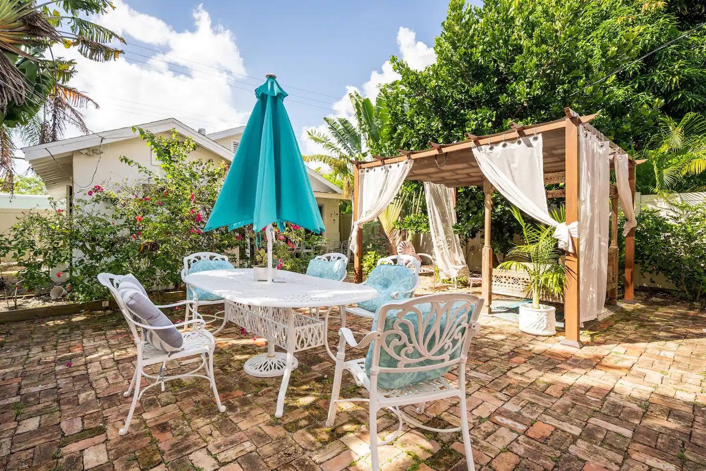 Outdoor seating under a big umbrella